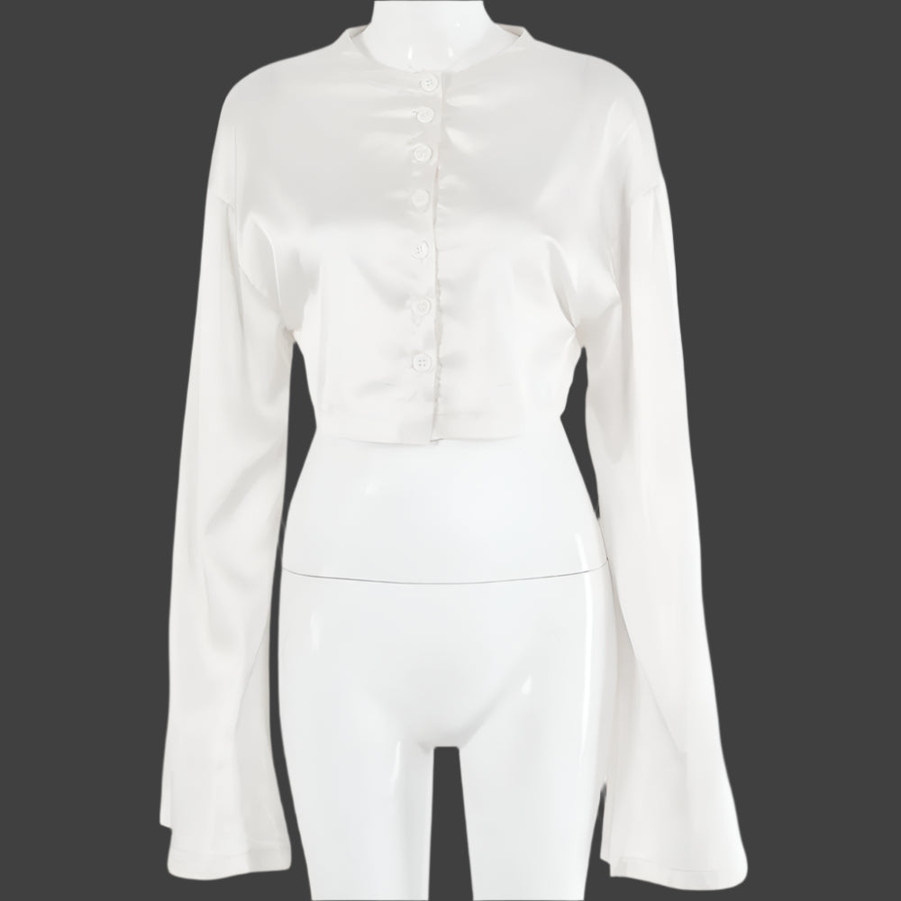 A model wearing a stylish two-piece set, featuring a high-waist tie skirt and a long-sleeved cardigan top, highlighting the flattering fit and elegant draping