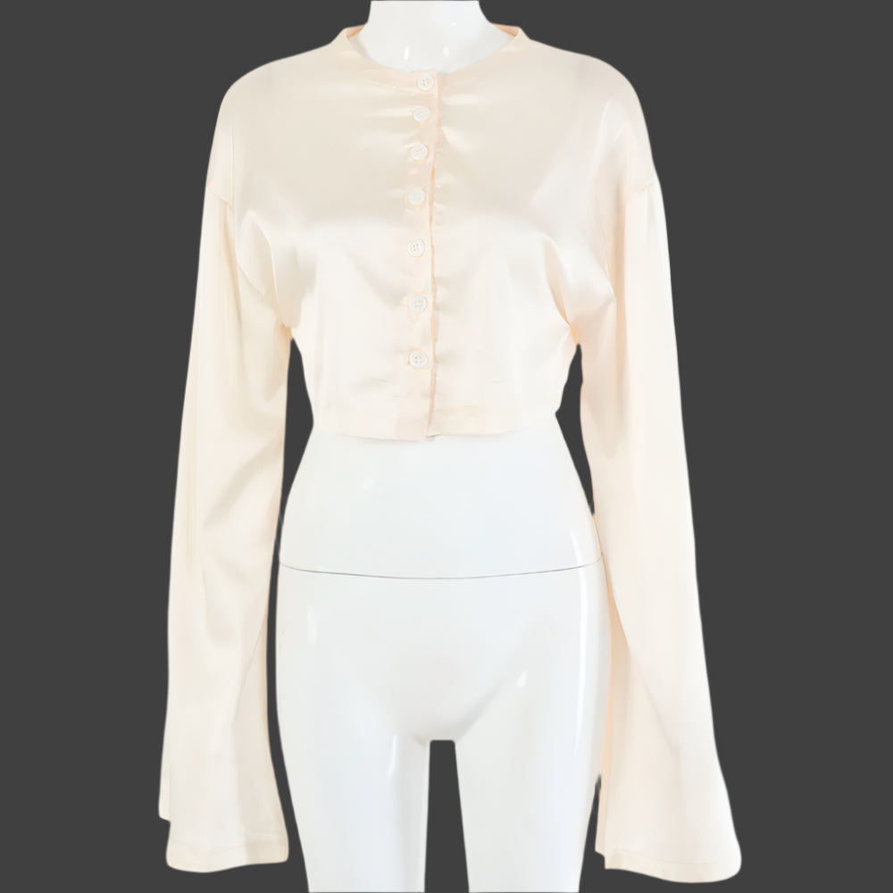 A model wearing a stylish two-piece set, featuring a high-waist tie skirt and a long-sleeved cardigan top, highlighting the flattering fit and elegant draping