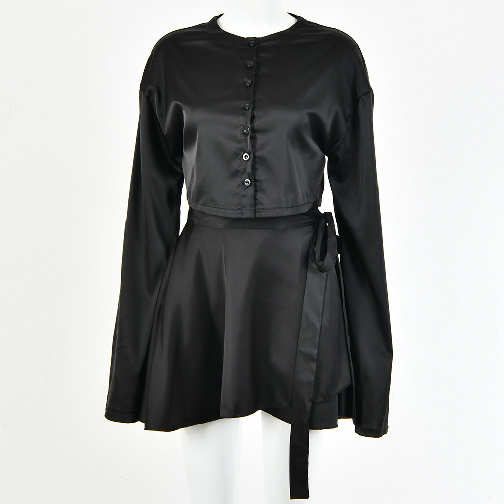 A model wearing a stylish two-piece set, featuring a high-waist tie skirt and a long-sleeved cardigan top, highlighting the flattering fit and elegant draping