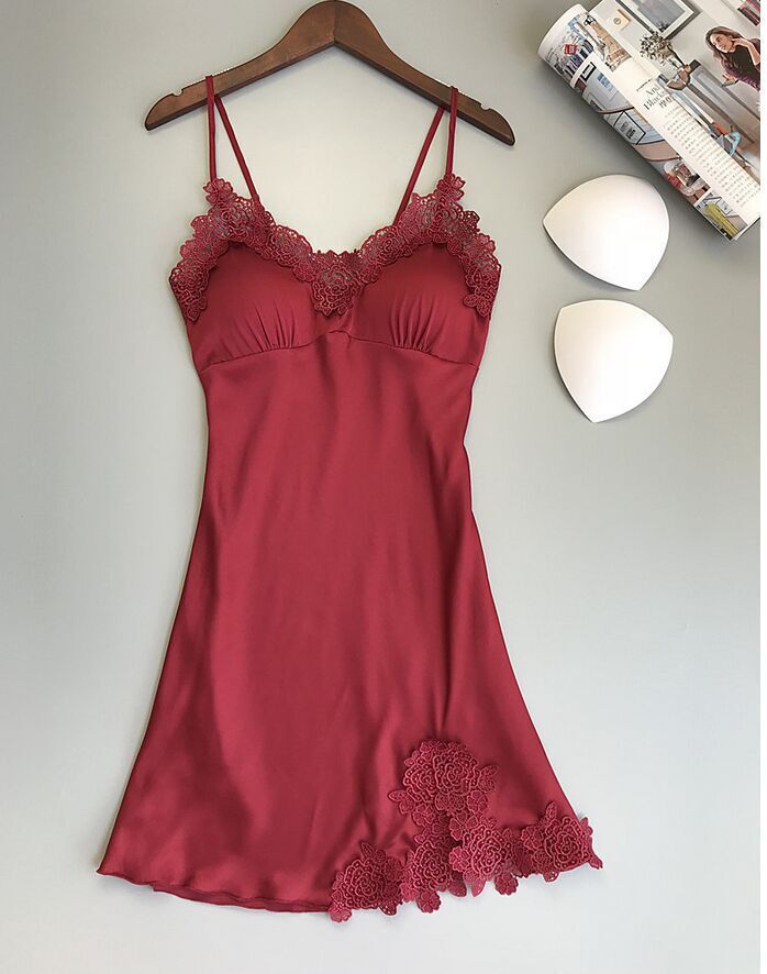 Sleeveless nightdress with lace detailing around the neckline and hem, displayed on a wooden hanger against a gray background—sexy, elegant, and perfect for homewear.