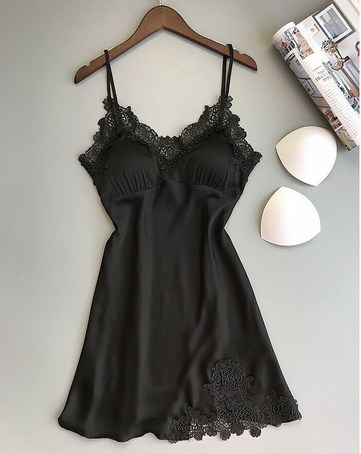 Sleeveless nightdress with lace detailing around the neckline and hem, displayed on a wooden hanger against a gray background—sexy, elegant, and perfect for homewear.