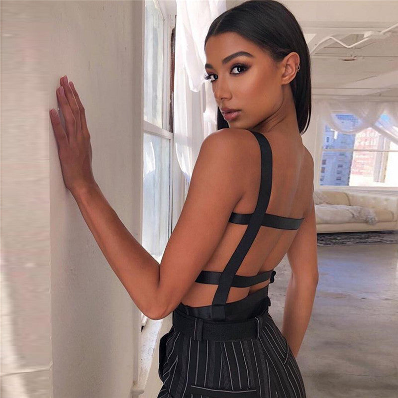 Chic sheer black top with thick straps, paired with high-waisted pinstripe pants featuring zipper details – stylish, edgy, and perfect for trendy outfits.