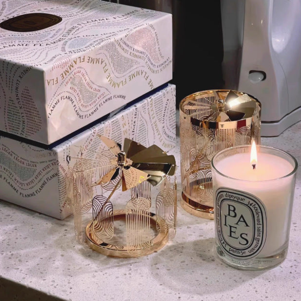 Display of Diptyque candles in clear glass jars with white labels, showcasing 24 visible scents including Baies, Tubereuse, Patchouli, and Gardenia, arranged in rows with varied wax colours