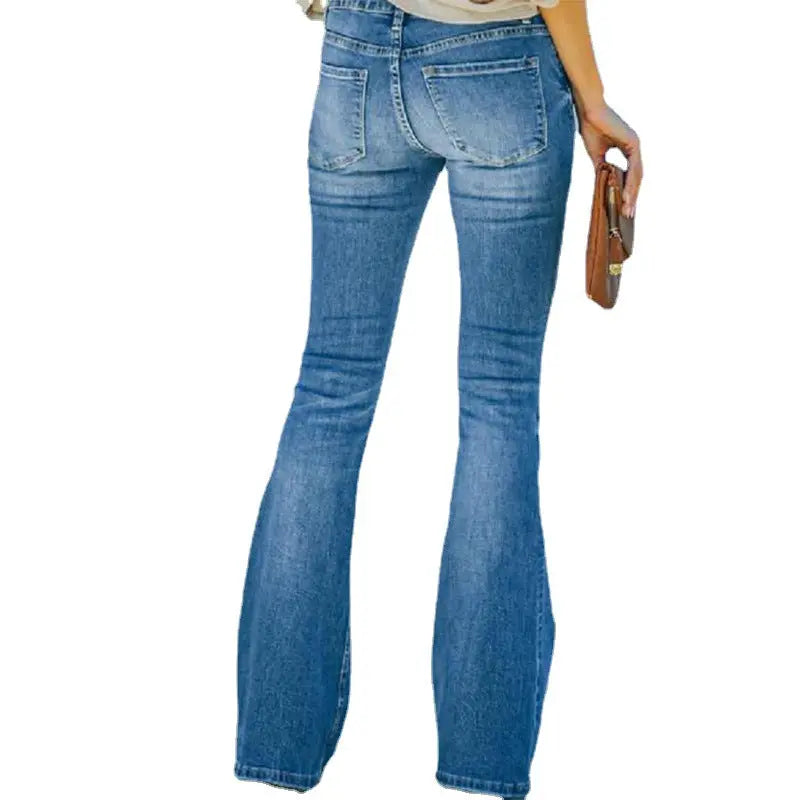 Woman wearing high-waist flared jeans with a button-front detail, styled with a light-colored blouse and brown clutch—elegant, flattering, and perfect for casual or dressy outfits.