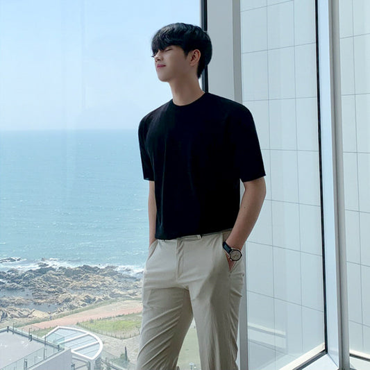 A men's ribbed knit t-shirt in black and blue, featuring a sleek textured fabric and a modern fit, ideal for versatile outfits.