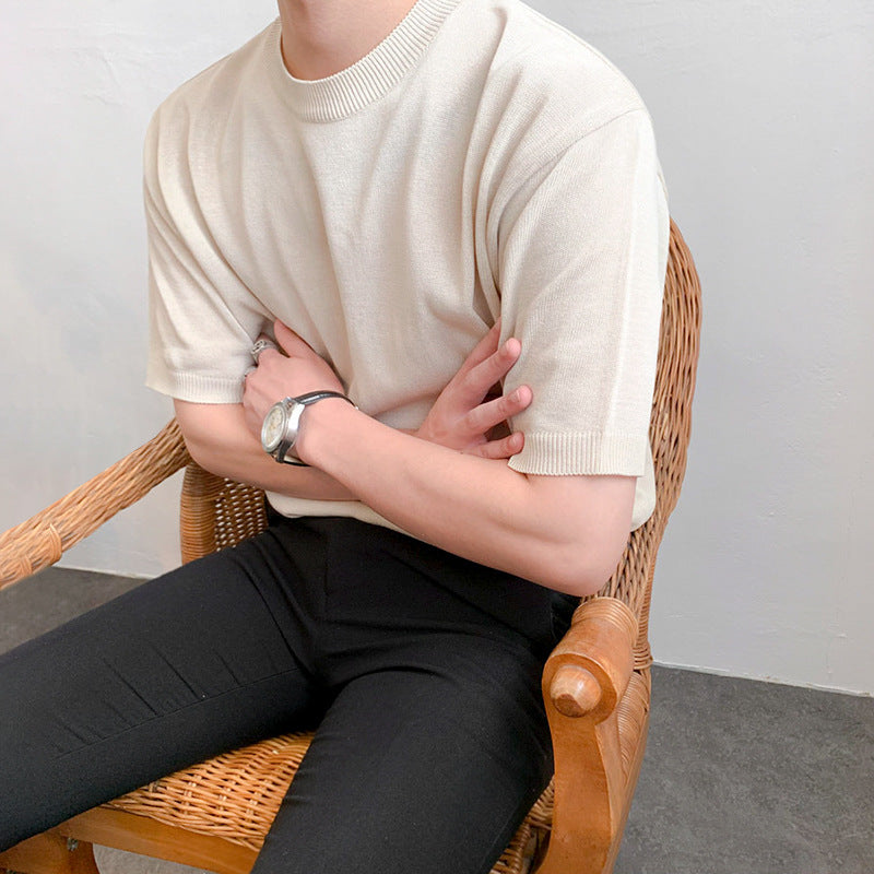 A men's ribbed knit t-shirt in black and blue, featuring a sleek textured fabric and a modern fit, ideal for versatile outfits.