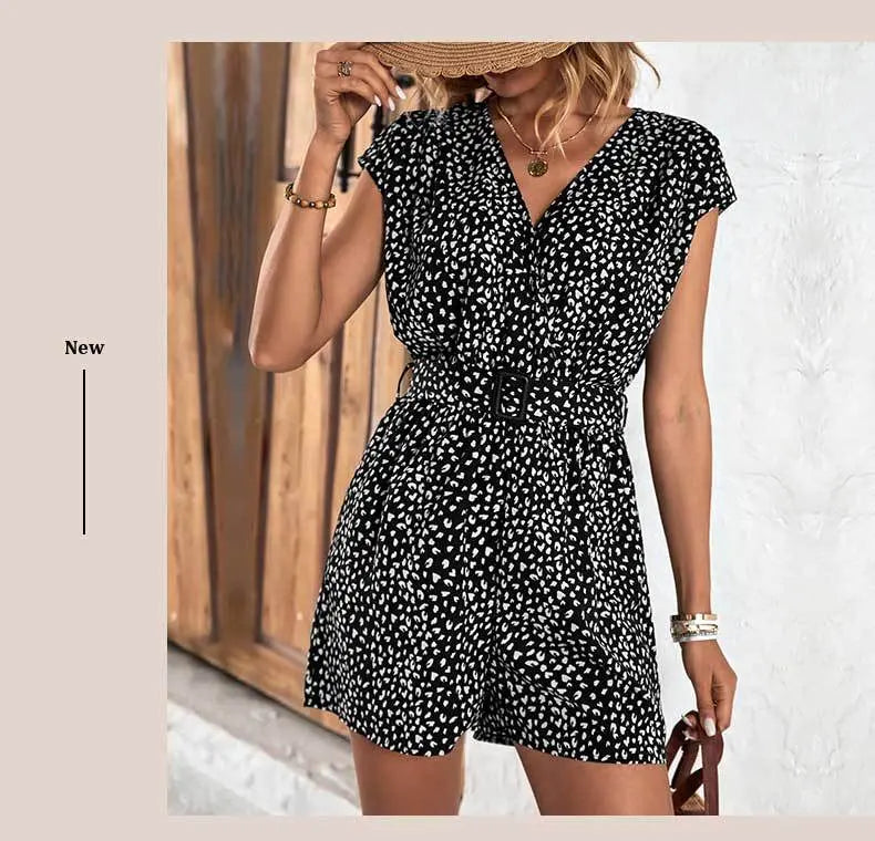 Stylish black polka dot romper with V-neck, short sleeves, and waist belt – lightweight, breathable, and perfect for casual or chic occasions.