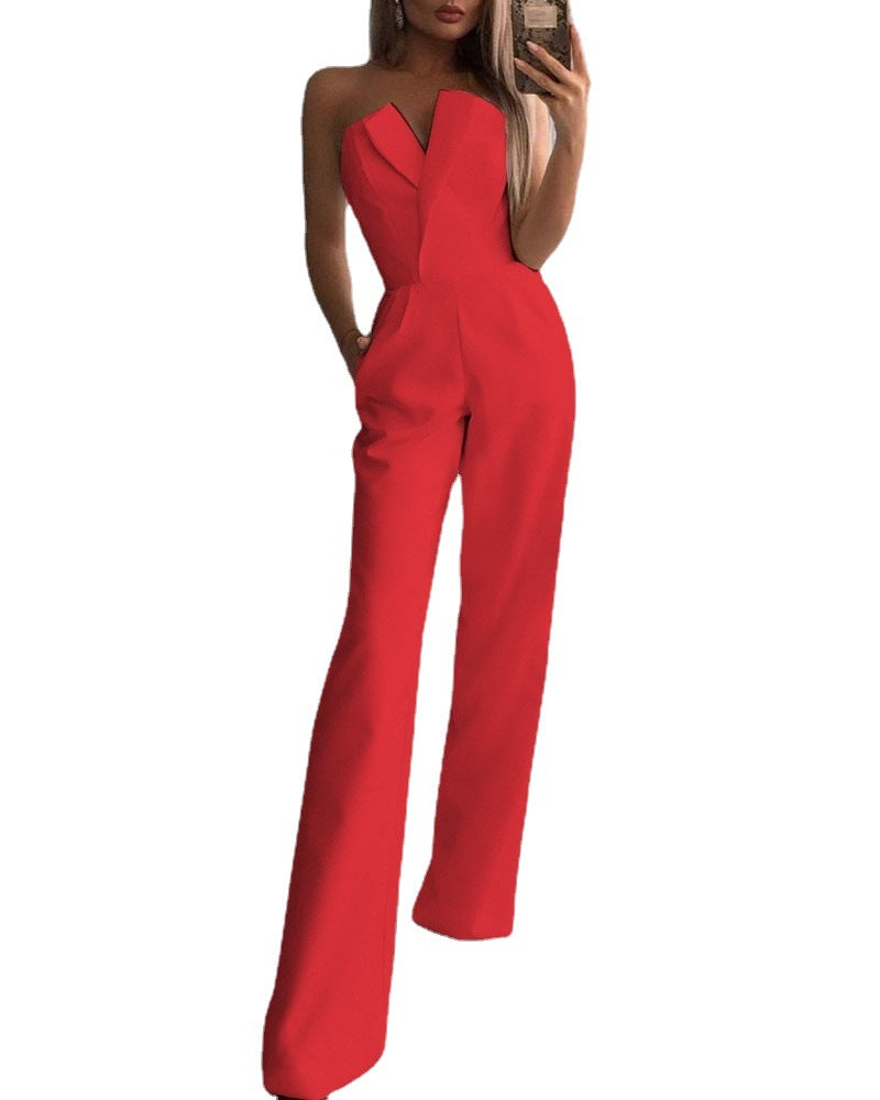 Stylish woman in a chic black strapless jumpsuit taking a mirror selfie, showcasing a sleek V-neckline and wide-leg silhouette—effortlessly elegant and modern.