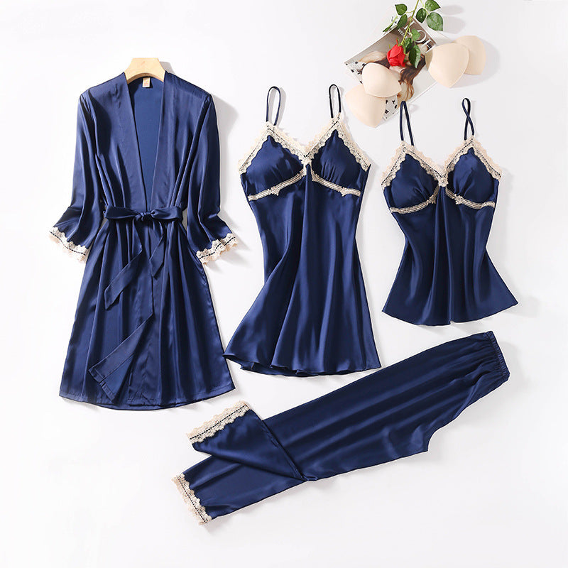 Teal silk sleepwear set featuring a robe, nightgown, camisole, and long pants with delicate white lace trim—luxurious, soft, and perfect for sleep and lounge.