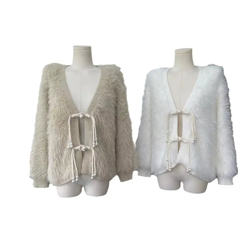 Two shaggy faux-fur cardigan jackets displayed on mannequin torsos against a plain white background. The left jacket is a light oatmeal beige, and the right jacket is white.