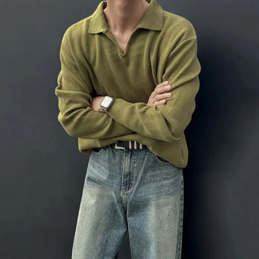 Green long-sleeve knitted sweater featuring a structured V-neck collar, ribbed cuffs, and hem, laid flat against a white background—classic, versatile, and perfect for layering.