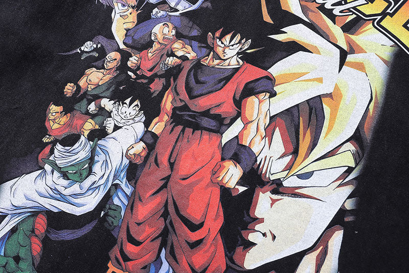 Black graphic t-shirt featuring Dragon Ball Z-inspired characters in battle stance, bold ‘ALLIANCE’ lettering above, and tagline ‘EVIL CANNOT DEFEAT JUSTICE’ below—perfect for anime fans and streetwear lovers.