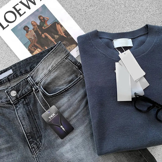 A stylish man wearing premium short sleeve t-shirts in charcoal gray, black, and forest green, highlighting the modern fit and versatile design.