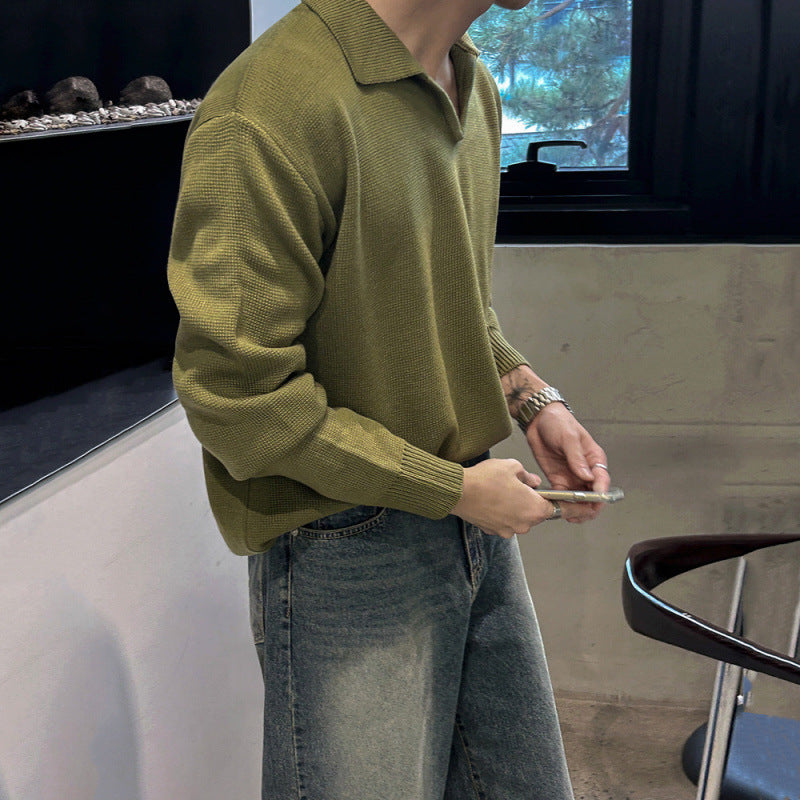 Green long-sleeve knitted sweater featuring a structured V-neck collar, ribbed cuffs, and hem, laid flat against a white background—classic, versatile, and perfect for layering.