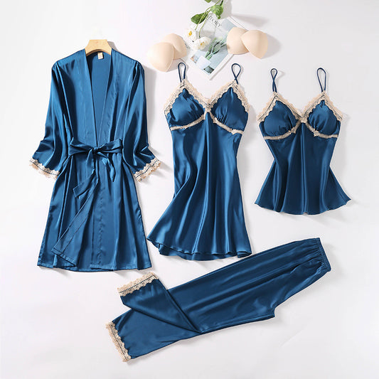 Teal silk sleepwear set featuring a robe, nightgown, camisole, and long pants with delicate white lace trim—luxurious, soft, and perfect for sleep and lounge.