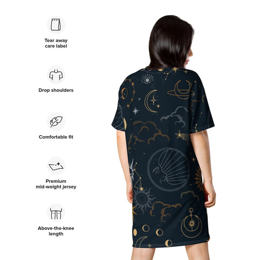 Person wearing a dark celestial-themed t-shirt dress featuring stars, moons, and planets, paired with sneakers—modern, artistic, and perfect for cosmic-inspired fashion.