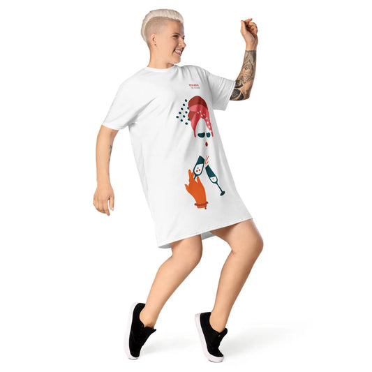 ProdWhite t-shirt dress featuring a bold graphic design with sunglasses, a pink polka-dot headscarf, red lips, and a wine-pouring illustration—effortless, stylish, and perfect for confident fashion.