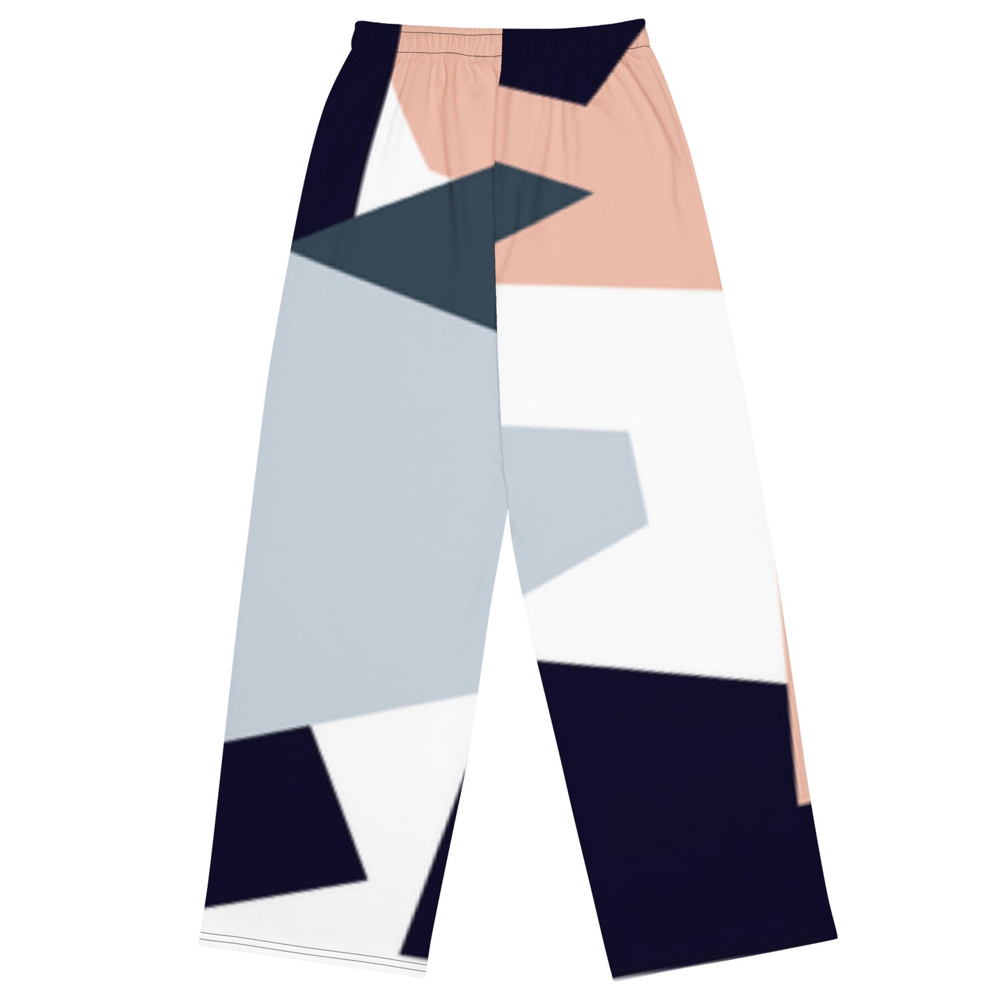 Woman wearing high-waist wide-leg pants with a geometric print in navy, light blue, pink, and white—styled with a beige long-sleeve shirt for an effortlessly chic look.