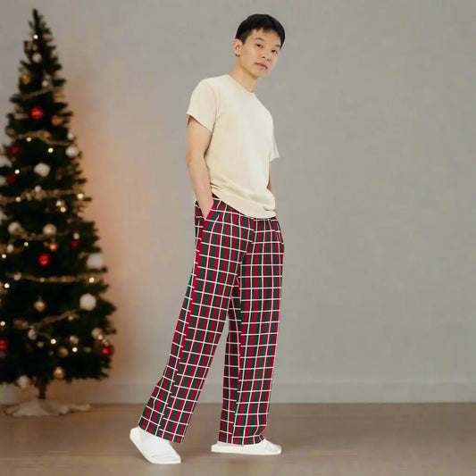 Person wearing red and green checkered Christmas pants, paired with a beige t-shirt and white shoes—festive, stylish, and perfect for holiday outfits.