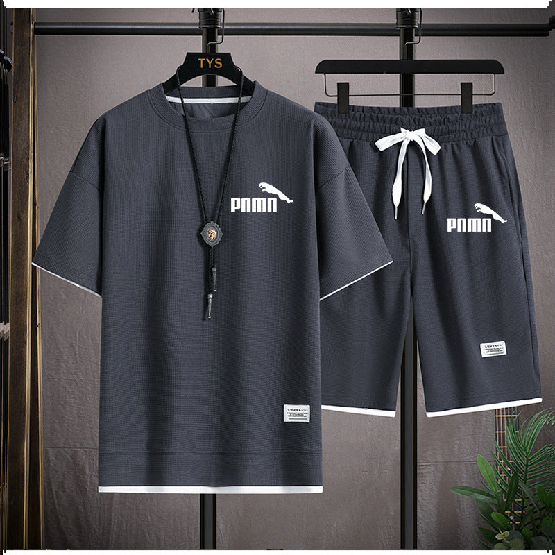 Dark grey breathable fabric with textured grid-like weave, showcasing quick-drying technology and eco-friendly production—perfect for activewear and performance clothing.
