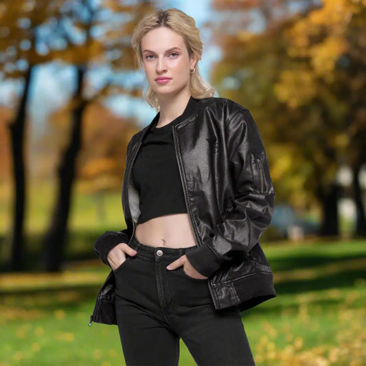 Black faux leather jacket with ribbed cuffs and hem, a zip-up front, soft grey inner lining, and a small embroidered deer logo on the chest—stylish, structured, and perfect for casual or dressy outfits.