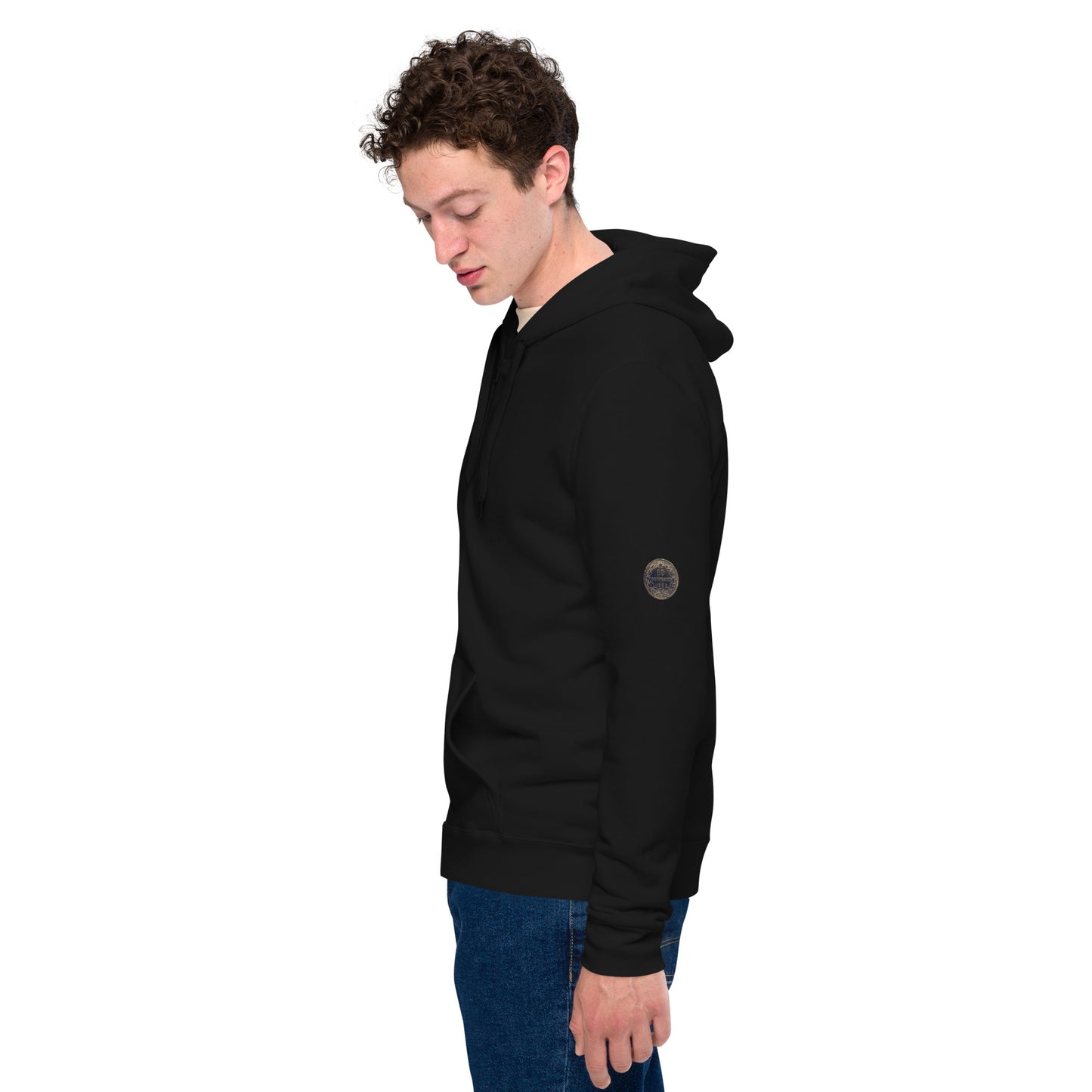 Person wearing a black zip-up hoodie featuring brushed fleece inside, kangaroo pockets, and a hood with matching drawstrings, paired with blue jeans—modern, comfortable, and perfect for athleisure styling.