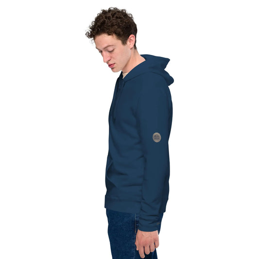 Person wearing a black zip-up hoodie featuring brushed fleece inside, kangaroo pockets, and a hood with matching drawstrings, paired with blue jeans—modern, comfortable, and perfect for athleisure styling.
