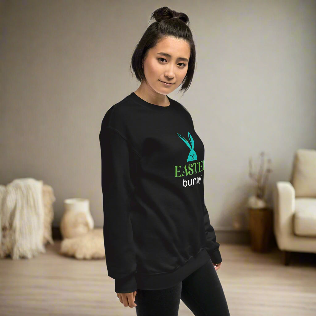 Black sweatshirt featuring a turquoise bunny head graphic with bold ‘EASTER bunny’ text—festive, stylish, and available in six colors excluding white.