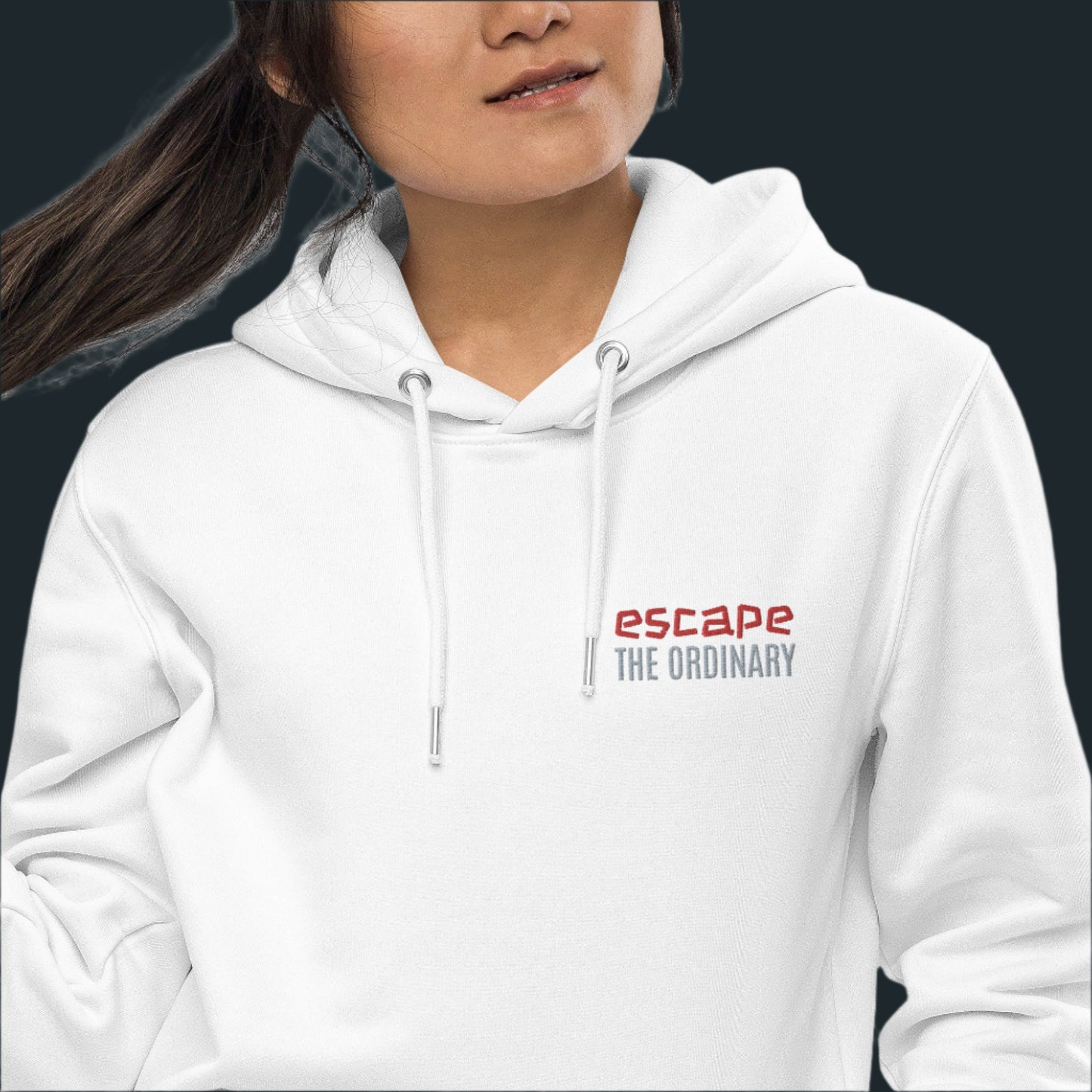 Minimalist street-style hoodie available in navy blue, black, and white, featuring a bold text design on the chest reading ‘escape’ in red and ‘THE ORDINARY’ in white, along with a front pocket and adjustable metal-tipped drawstring hood.