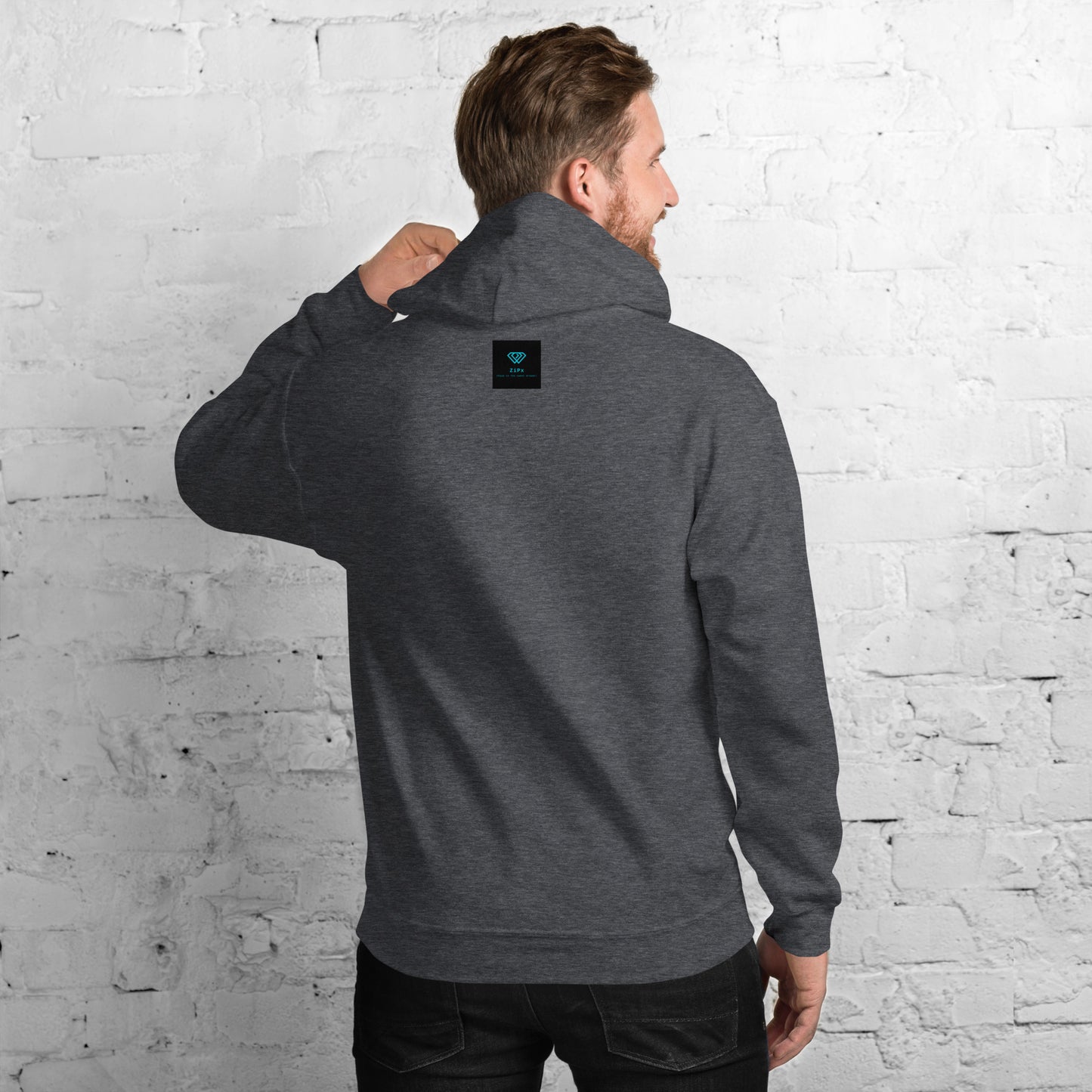 deep grey hoodie featuring an embroidered letter ‘T’ on the left chest, worn against a white brick wall—modern, stylish, and available in black, navy, and Red.