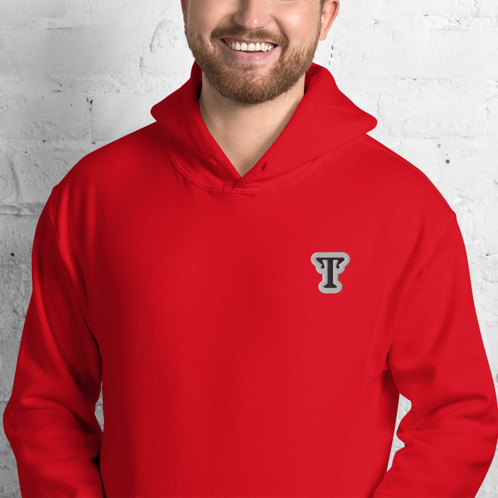Red hoodie featuring an embroidered letter ‘T’ on the left chest, worn against a white brick wall—modern, stylish, and available in black, navy, and deep grey.