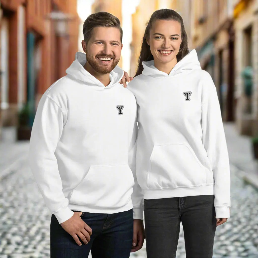Two people wearing white hoodies featuring an embroidered letter ‘T’ on the left chest, standing close together with arms around each other—modern, stylish, and available in black, grey, and navy blue.