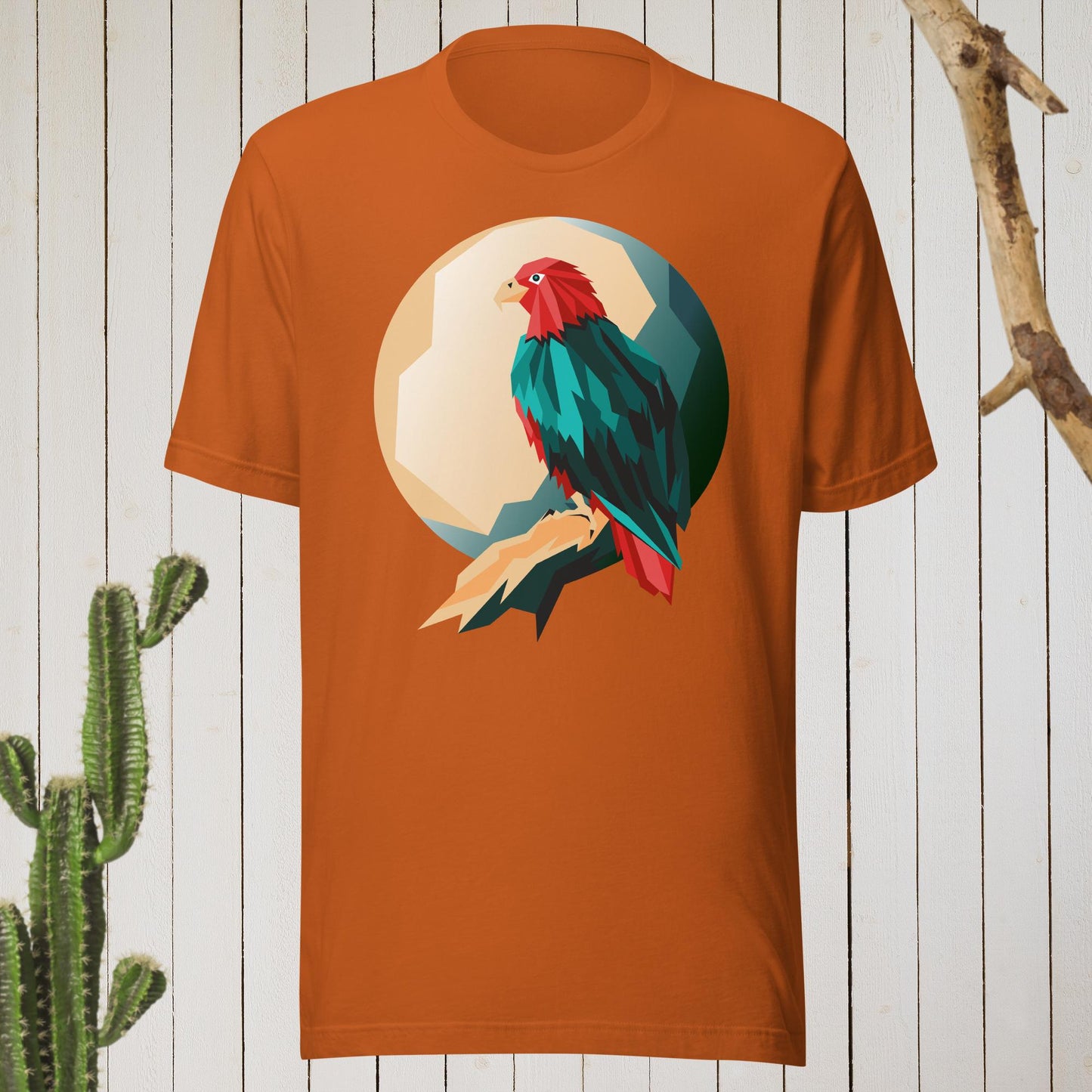 Dark gray t-shirt featuring a geometric bird design with a red head and teal-green body on the front, and bold blue text reading ‘I’M AWESOME’ on the back—stylish, artistic, and perfect for casual wear.