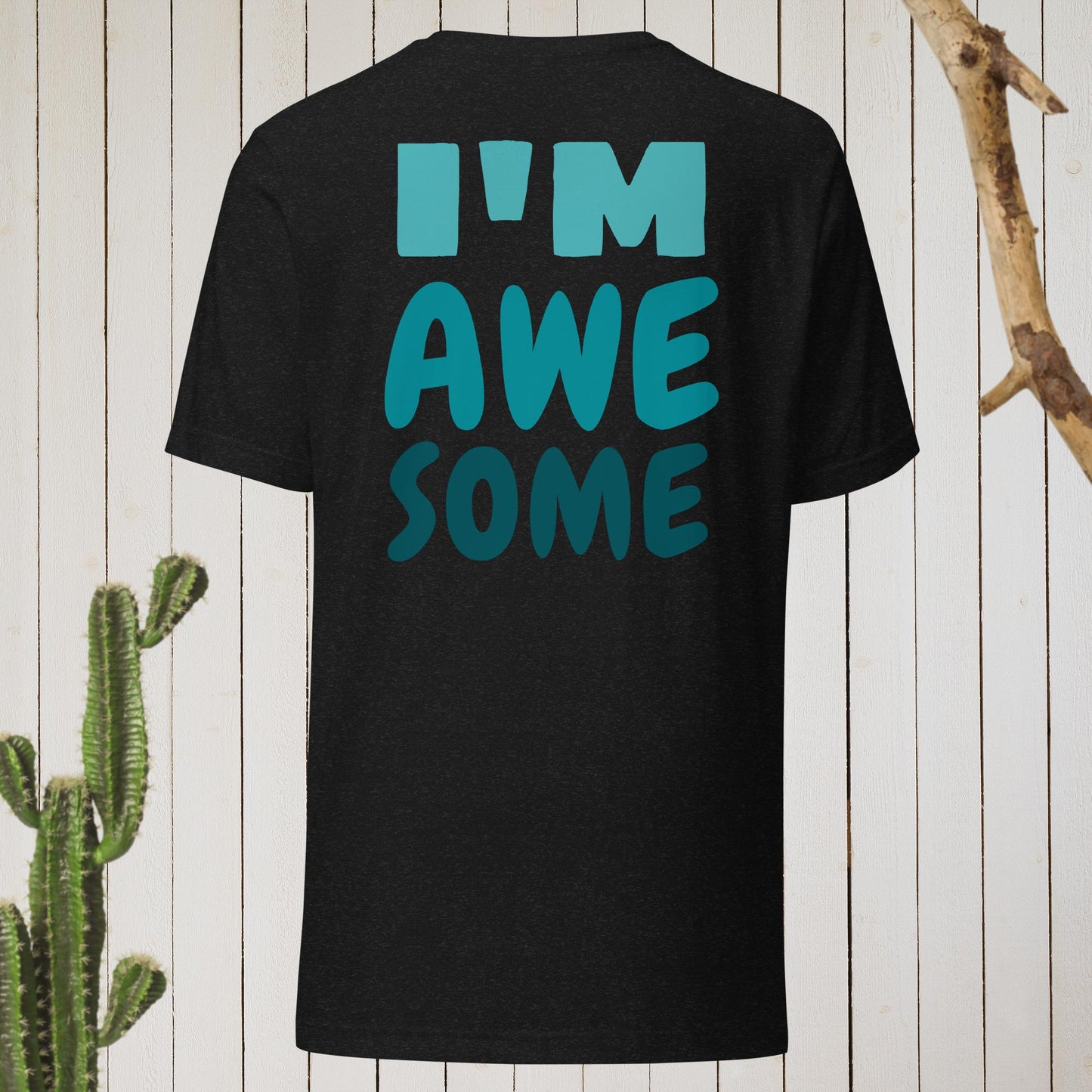 Dark gray t-shirt featuring a geometric bird design with a red head and teal-green body on the front, and bold blue text reading ‘I’M AWESOME’ on the back—stylish, artistic, and perfect for casual wear.