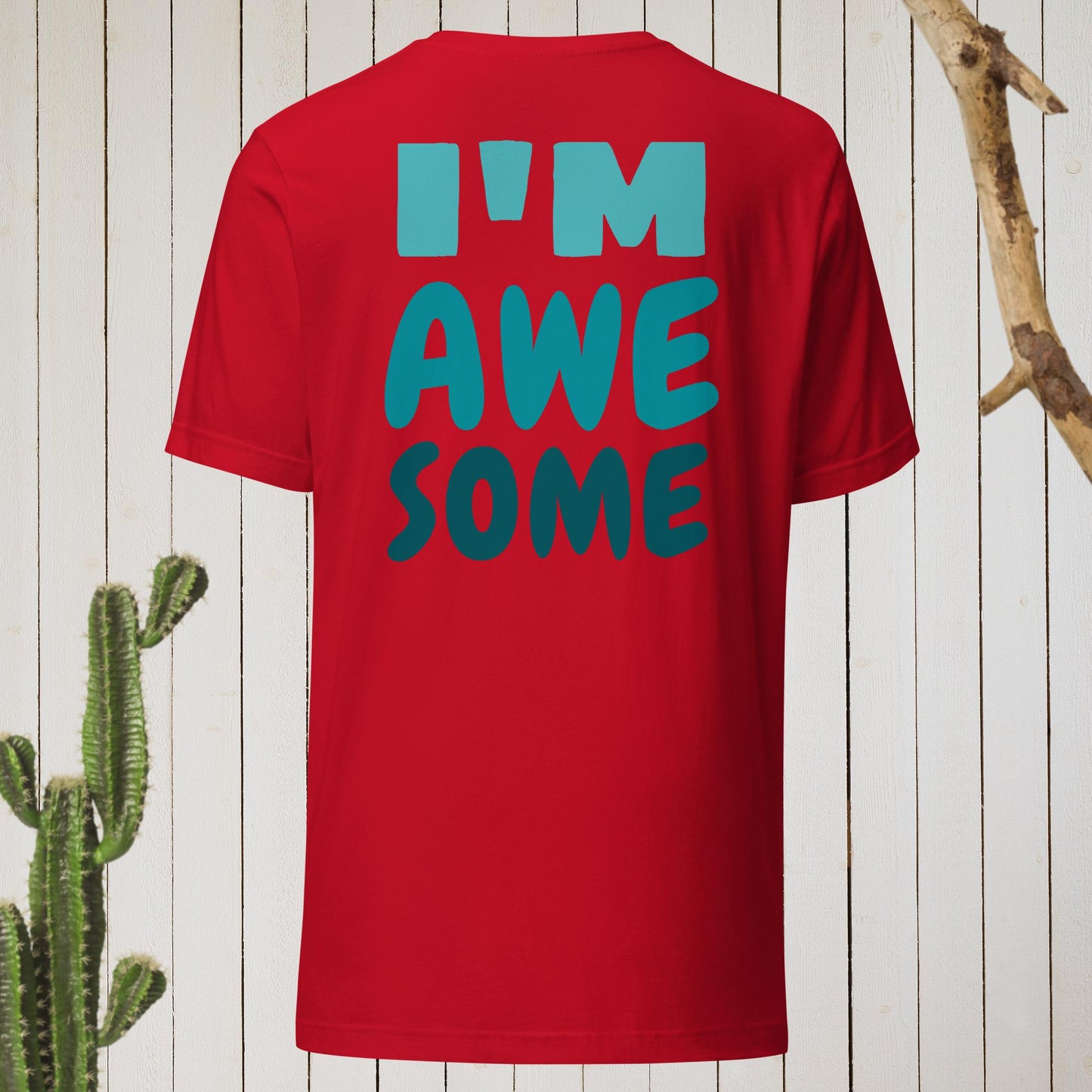 Red t-shirt featuring a geometric bird design with a red head and teal-green body on the front, and bold blue text reading ‘I’M AWESOME’ on the back—stylish, artistic, and perfect for casual wear.