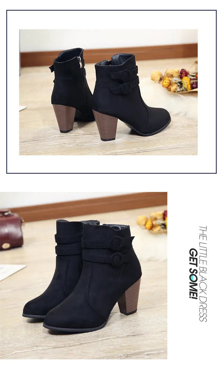 Black ankle boots with wooden heel on a light wooden floor, with 'The Little Black Dress' branding.