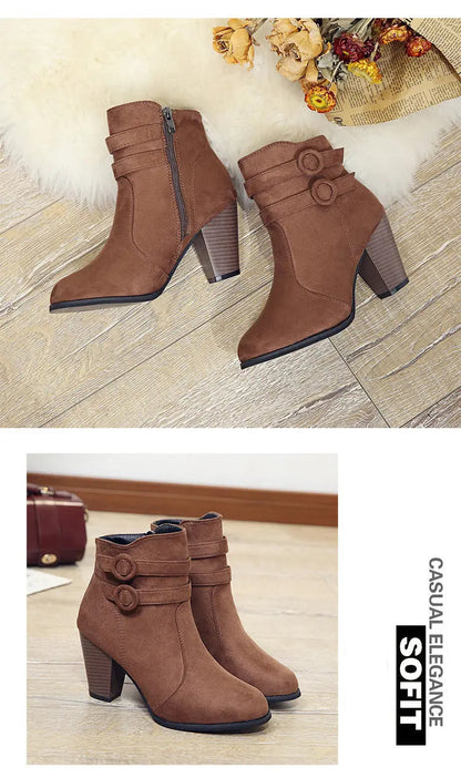 Brown ankle boots with a block heel on a wooden floor background.