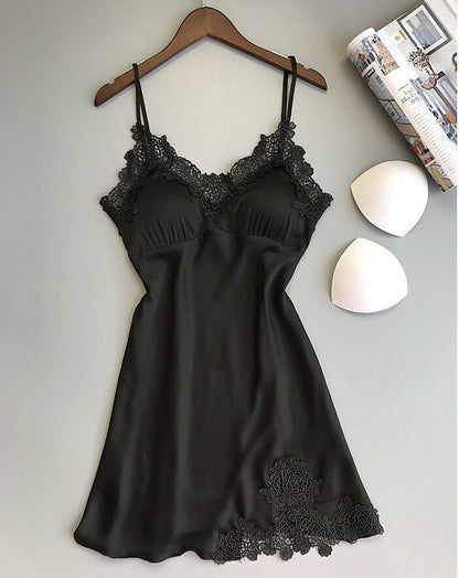 Sleeveless nightdress with lace detailing around the neckline and hem, displayed on a wooden hanger against a gray background—sexy, elegant, and perfect for homewear.