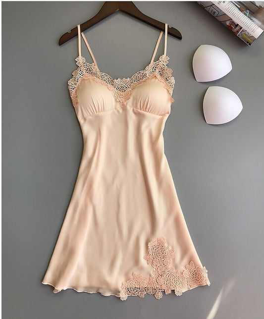 Sleeveless nightdress with lace detailing around the neckline and hem, displayed on a wooden hanger against a gray background—sexy, elegant, and perfect for homewear.