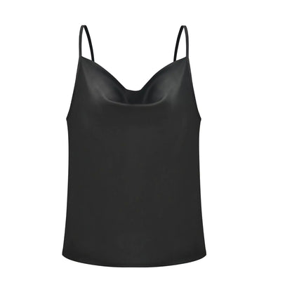 Black satin camisole top, styled with a light blue denim skirt, holding a branch with green leaves—modern, elegant, and perfect for casual or dressy looks.