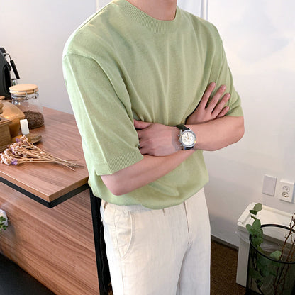 A men's ribbed knit t-shirt in black and blue, featuring a sleek textured fabric and a modern fit, ideal for versatile outfits.