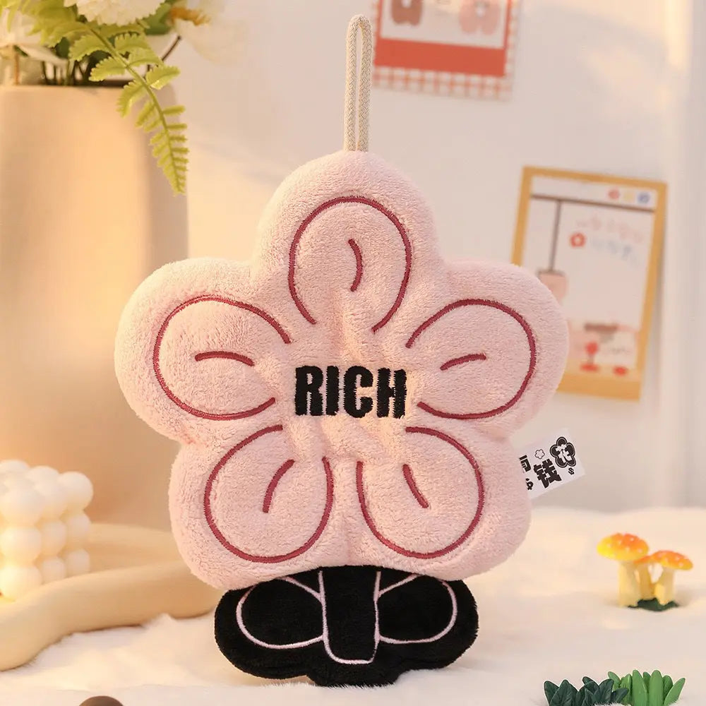 A playful prosperity-inspired flower towel designed to add charm, comfort, and positive energy to your home.