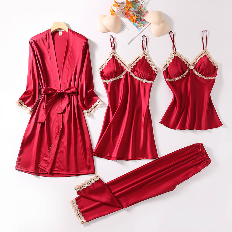 Teal silk sleepwear set featuring a robe, nightgown, camisole, and long pants with delicate white lace trim—luxurious, soft, and perfect for sleep and lounge.