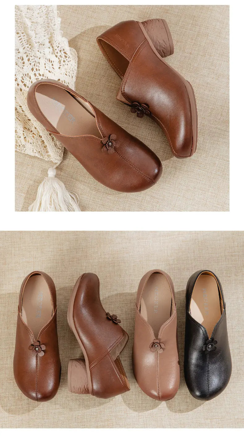 Four low-heeled slip-on ankle boots arranged on a beige textured surface, shown in brown, tan, and black. Each boot has a small decorative bow at the center front.