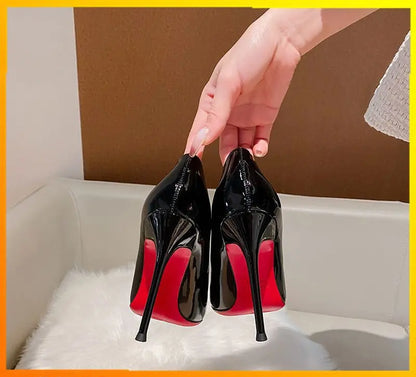 A bold, high-shine heel designed to command attention with timeless elegance.