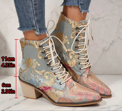 A pair of lace-up ankle boots with a light blue base and ornate gold, pink, and blue brocade-style pattern, shown on a person's feet with jeans. Red text on the image indicates boot heights of 11 cm and 6 cm.