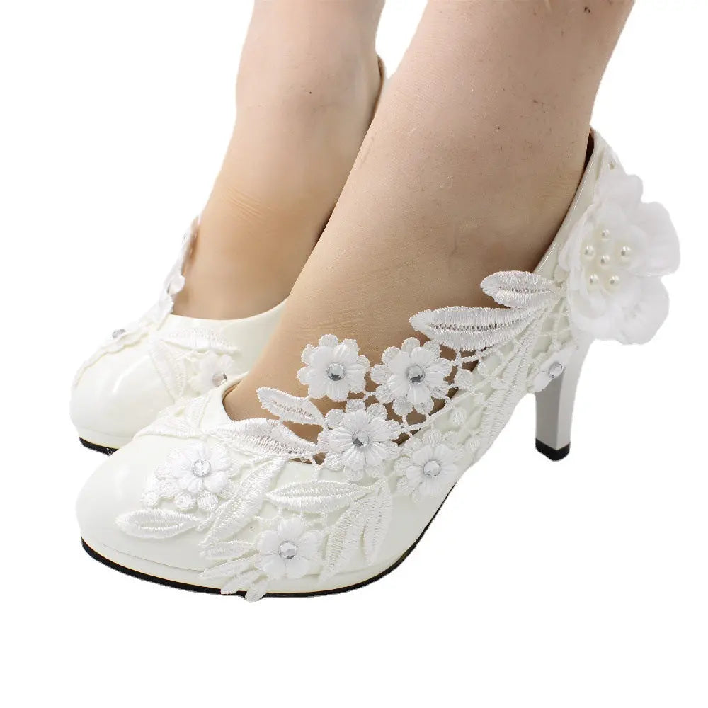 Romantic floral lace heels crafted to order for your special day.
