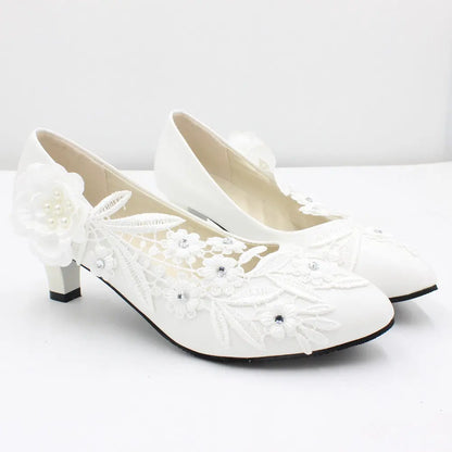 Romantic floral lace heels crafted to order for your special day.
