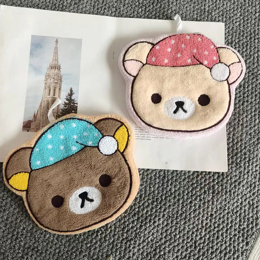 Bring a touch of cuteness to your kitchen or bathroom with these soft plush hanging towels.