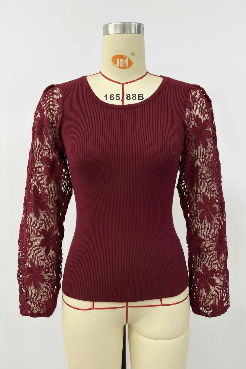 A women's long-sleeve top in deep burgundy, featuring a ribbed body and sheer floral lace sleeves, displayed on a cream-colored dress form mannequin.